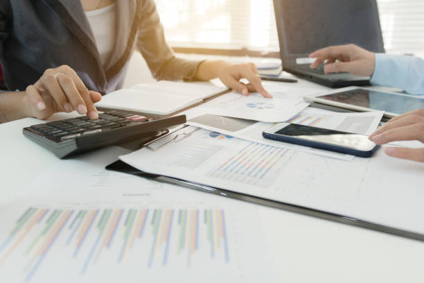 istock Investor executive discussing plan financial graph data on office table with laptop and tablet, finance, accounting, investment, meeting. 855252466