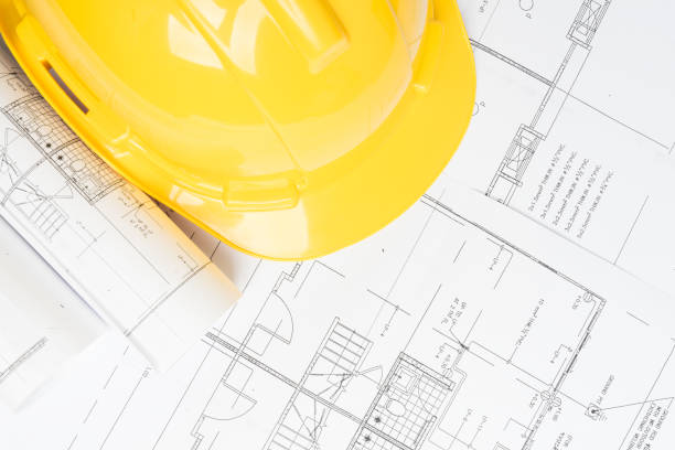 istock office desk with helmet on white background 855255876