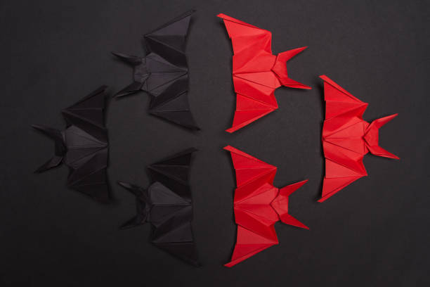 istock Halloween Background. Black background. Red and black bats 855263618