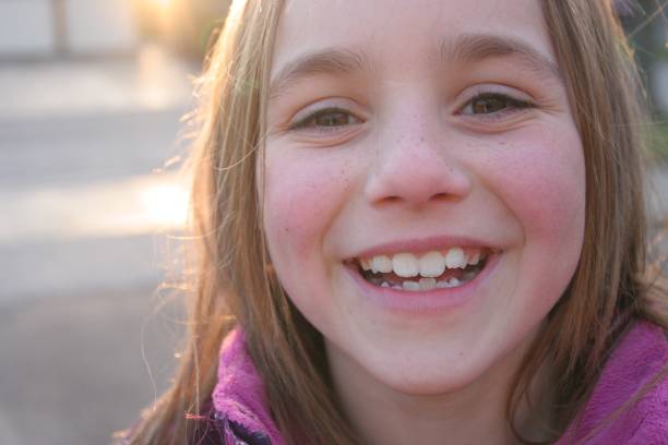 istock Young girl smiles at camera 855265830