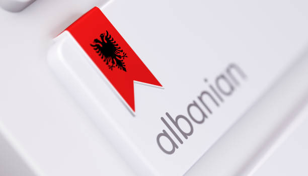 High quality 3d render of a modern keyboard with Albanian text and Albanian flag. Albanian keyboard button has an Albanian flag icon on it and it is in focus. Horizontal composition with copy space.