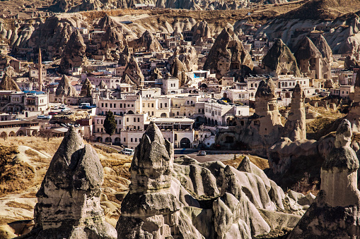 Volcanic land, rock formation, city in fairy chimneys, Cappadocia in Turkey.