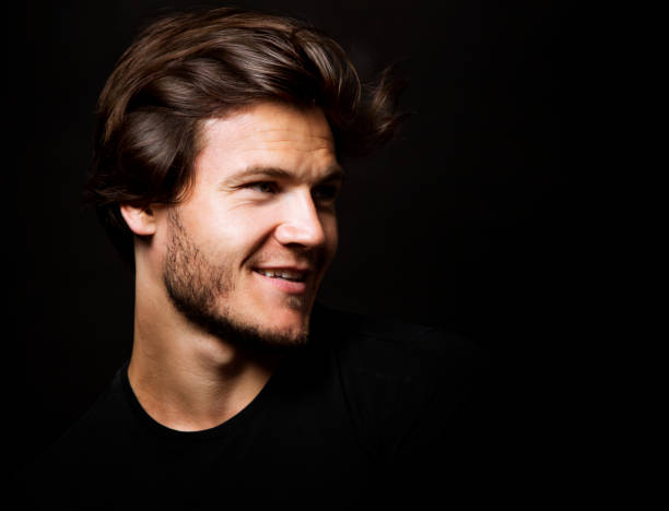 istock caucasian man wearing  black tshirt and trendy hairstyle 855273492