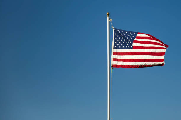 istock American flag on the blue sky 855274238