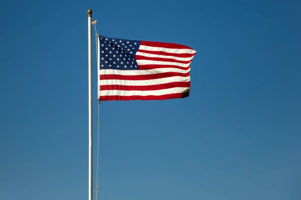 istock American flag on the blue sky 855274240