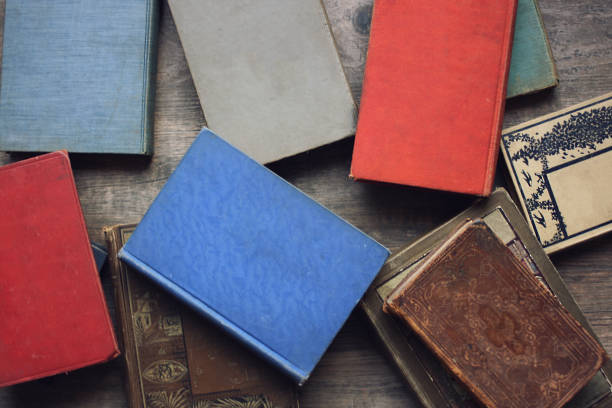 istock Stack of Old Vintage Books From Above on Rustic Wood Table 855283766