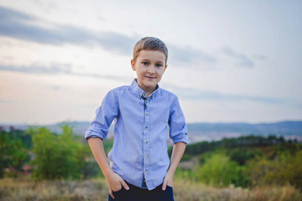 outdoor portrait of joyful ten years old boy - 10 11 years cheerful happiness fun imagens e fotografias de stock