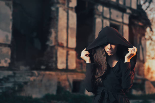 istock Mysterious Evil Spirit in Front of a Horror Abandoned House 855292108