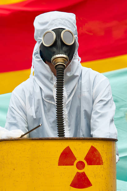 istock A man in bio-hazard suit and gas mask. 855301642