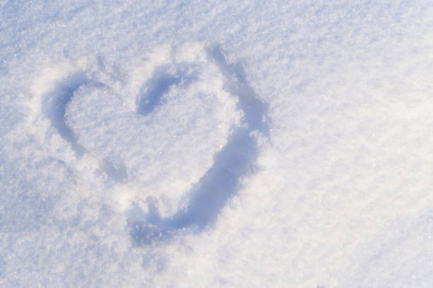 istock heart shape of snow 855313114