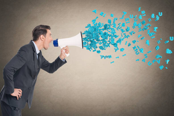 istock Businessman screaming into megaphone 855313498