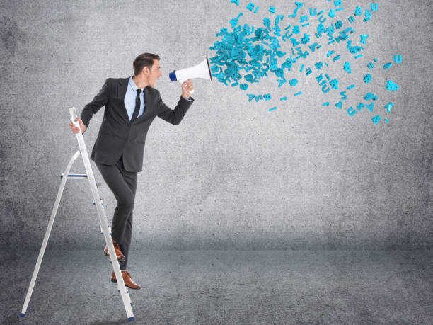 istock Businessman screaming into megaphone 855313522