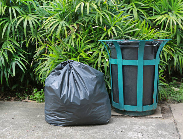 istock Plastic trash bags and rubbish bin in a park. 855314014