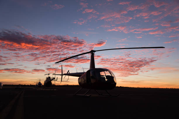 helicopters getting ready for dawn take off stock photo