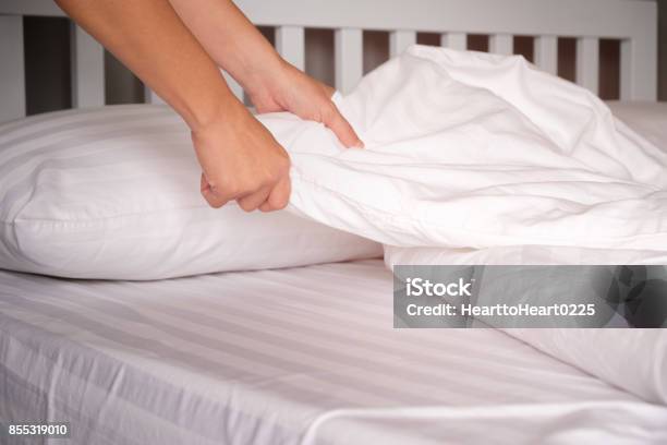 The Hands Of Housewives Who Are Changing Sheets In Hotels Stock Photo - Download Image Now