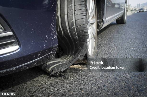 Damaged Tire After Tire Explosion At High Speed On Highway Stock Photo - Download Image Now