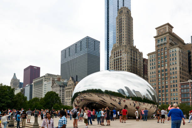 Millennium Park, Chicago featuring the Cloud Gate sculpture. Also known as the Bean. CHICAGO, IL - SEPTEMBER 2, 2017: Millennium Park, Chicago featuring the Cloud Gate sculpture. Also known as the Bean. millennium park stock pictures, royalty-free photos & images