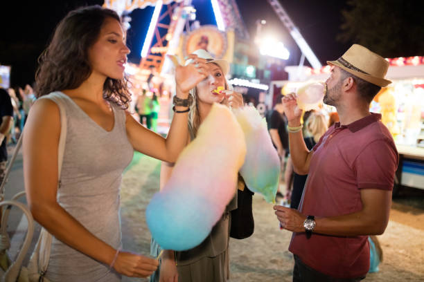 istock Sharing candy cotton at amusement park 855323190