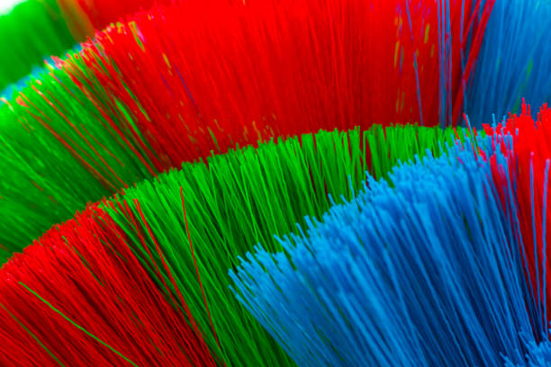 istock The colorful and patterns of plastic brooms. 855326244