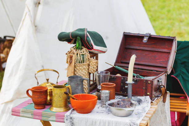 istock Old fashioned interior items, dishes and kitchen utensils. Historical reconstruction of 19 century. 855330228
