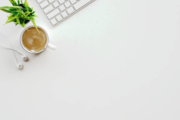 istock White office desk table with a lot of things on it. Top view with copy space. 855330446