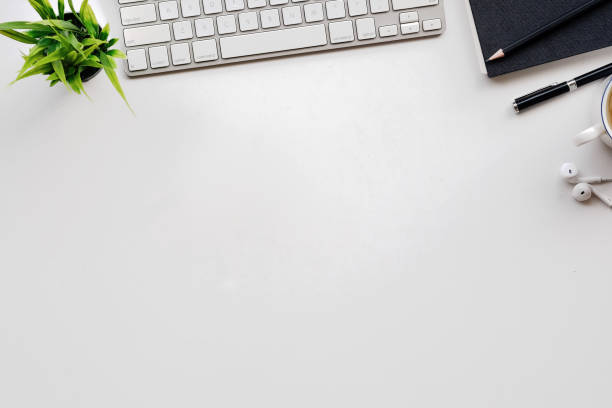 istock White office desk table with a lot of things on it. Top view with copy space. 855330472