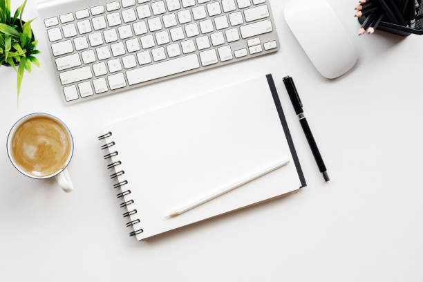 istock White office desk table with a lot of things on it. Top view with copy space. 855330528