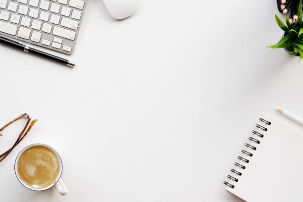 istock White office desk table with a lot of things on it. Top view with copy space. 855330552