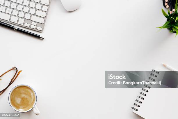 White Office Desk Table With A Lot Of Things On It Top View With Copy Space Stock Photo - Download Image Now