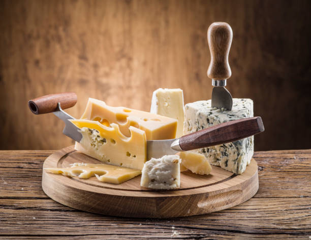 istock Variety of cheeses on a wooden board. 855334162