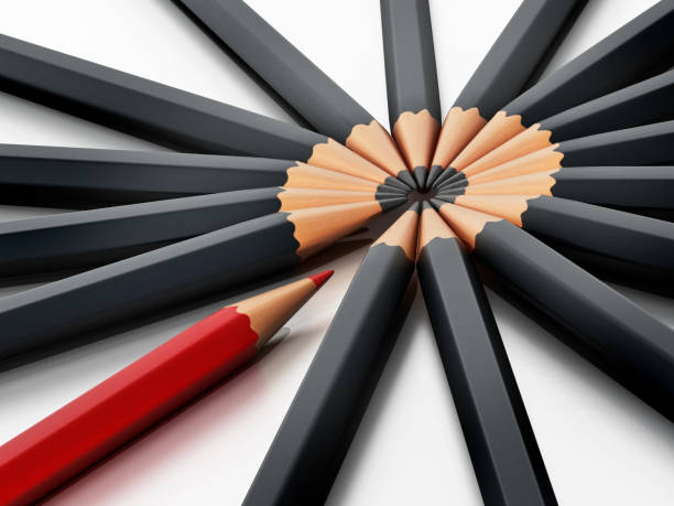 istock Red pencil standing out from group of black pencils 855337770