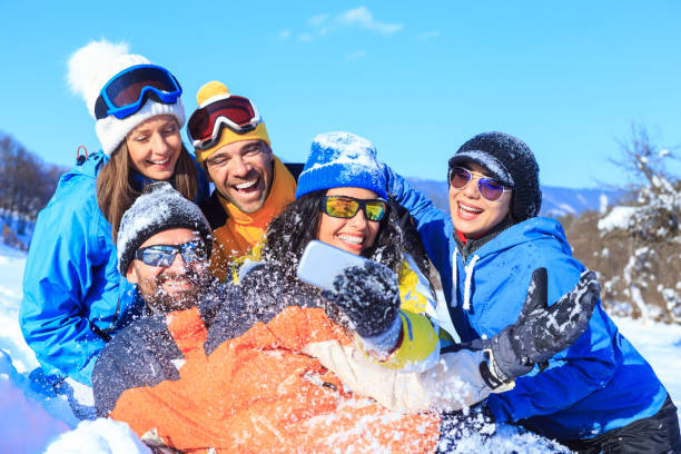 istock Group of young skiers making selfie on snow mountain 855341016