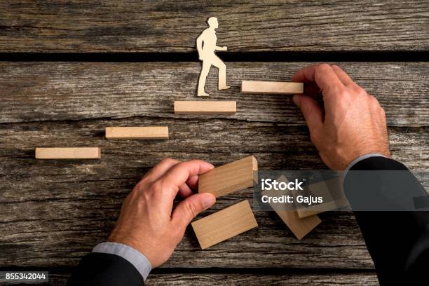 Conceptual Image Of Personal And Career Promotion Stock Photo - Download Image Now - Staircase, Achievement, Assistance