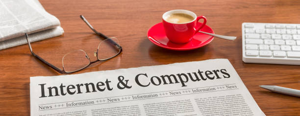 istock A newspaper on a wooden desk - Internet and Computers 855342364