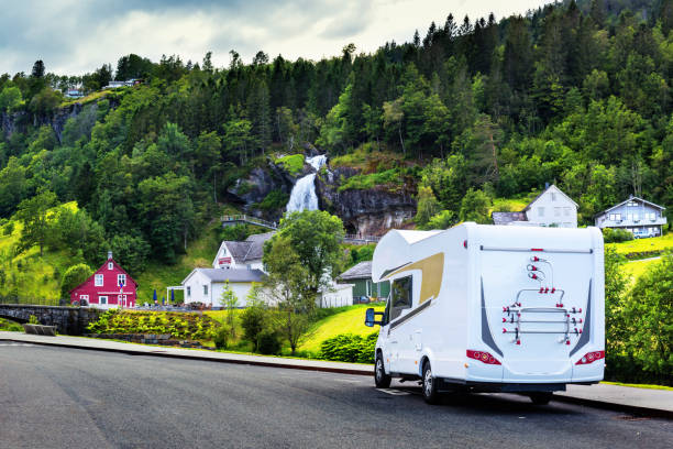 istock White camper near Steinsdalsfossen waterfall 855342608
