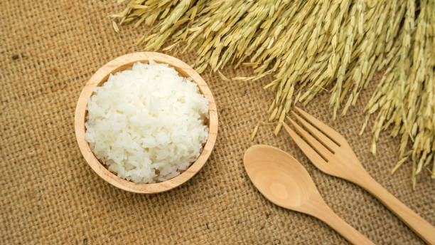 istock Jasmine rice in a bowl on a wooden table. 855345986