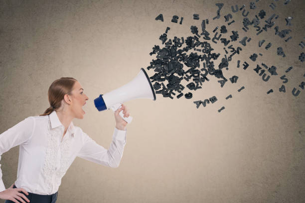 istock Businesswoman screaming into megaphone 855348504