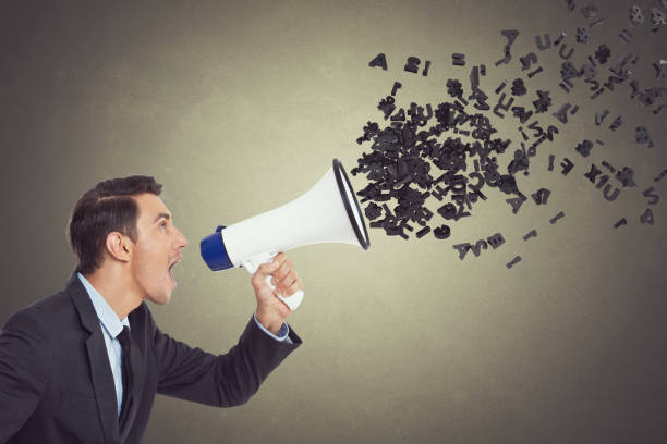 istock Businessman screaming into megaphone 855348570