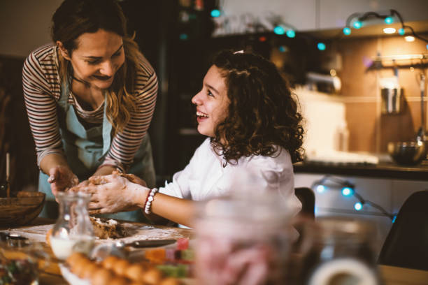 istock Mother and daughter making Gingerbread cookies for Christmas 855349564
