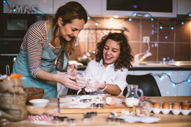 istock Mother and daughter making Gingerbread cookies for Christmas 855349772