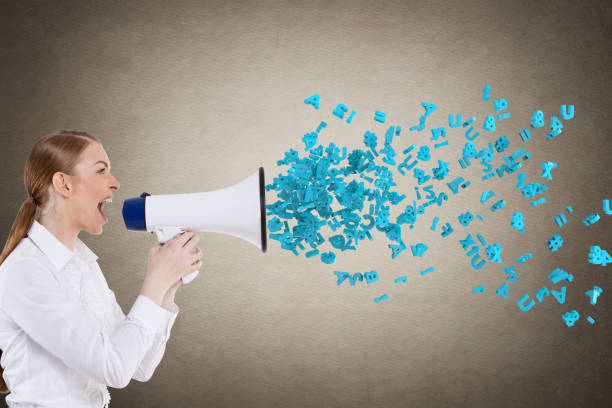 istock Businesswoman screaming into megaphone 855352074