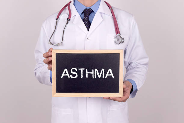 istock Doctor holding mini blackboard with ASTHMA message 855352728