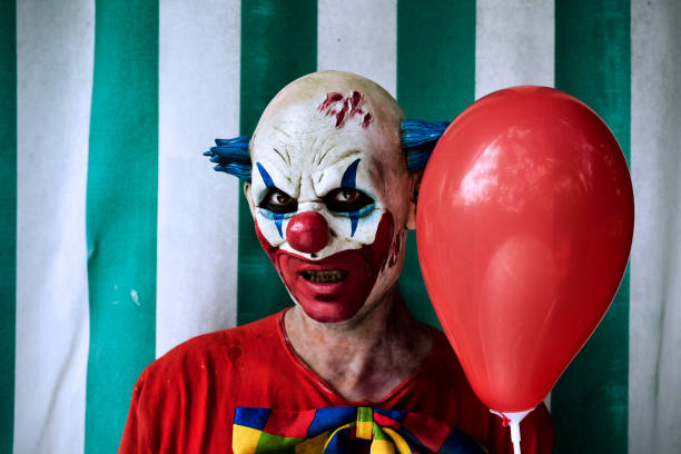 istock scary evil clown in the circus 855353080