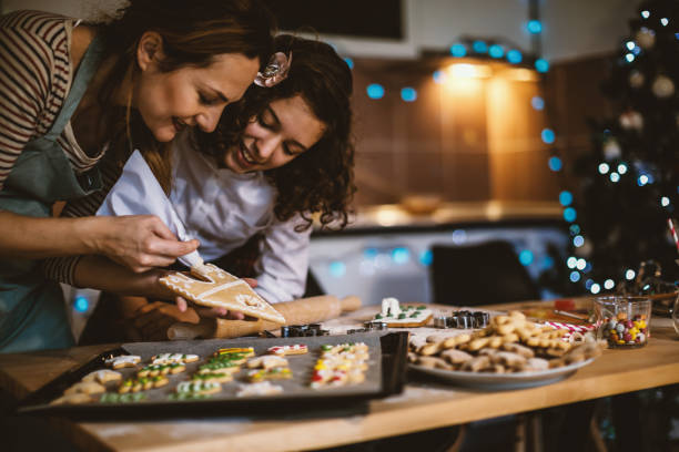 istock Mother and daughter making Gingerbread cookies for Christmas 855358846