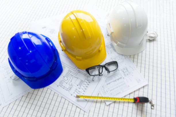istock top view Safety helmet white,blue and yellow for foreman/engineer/architect/visitor use in construction site for safety work,worker,industry