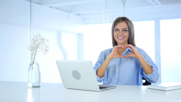 istock Heart Sign by Woman in Office, Hands Gesture 855359912