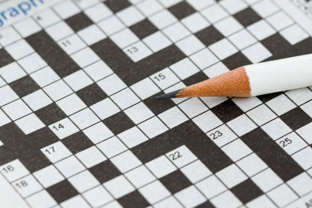 istock Crossword Puzzle and Pencil 855360286