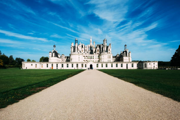Tourists outside the entrance to Chateau de Chambord near the town of Blois in the Loire Valley of France. Of many chateaux in the Loire region it is the largest, and also the most expressive architecturally.