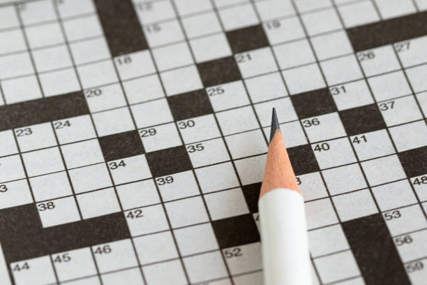 istock Crossword Puzzle and Pencil 855364050
