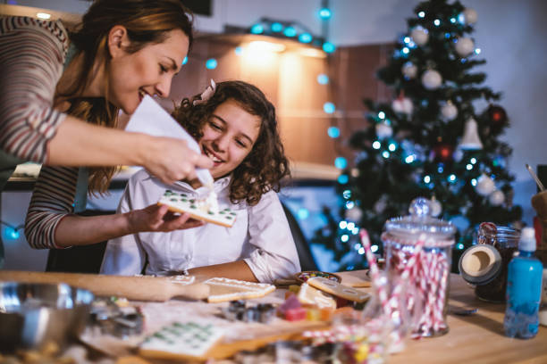 istock Mother and daughter making Gingerbread cookies for Christmas 855364104